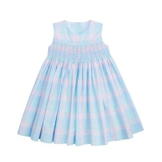 Light blue dress with white polka dots on a white background